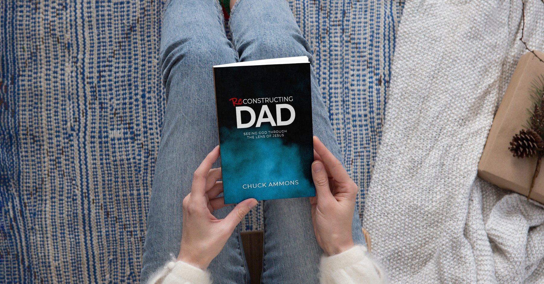 Reconstructing Dad by Chuck Ammons, held in hand